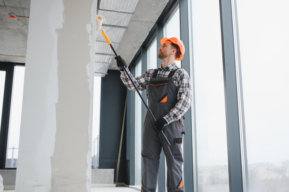 Commercial painter working on a building